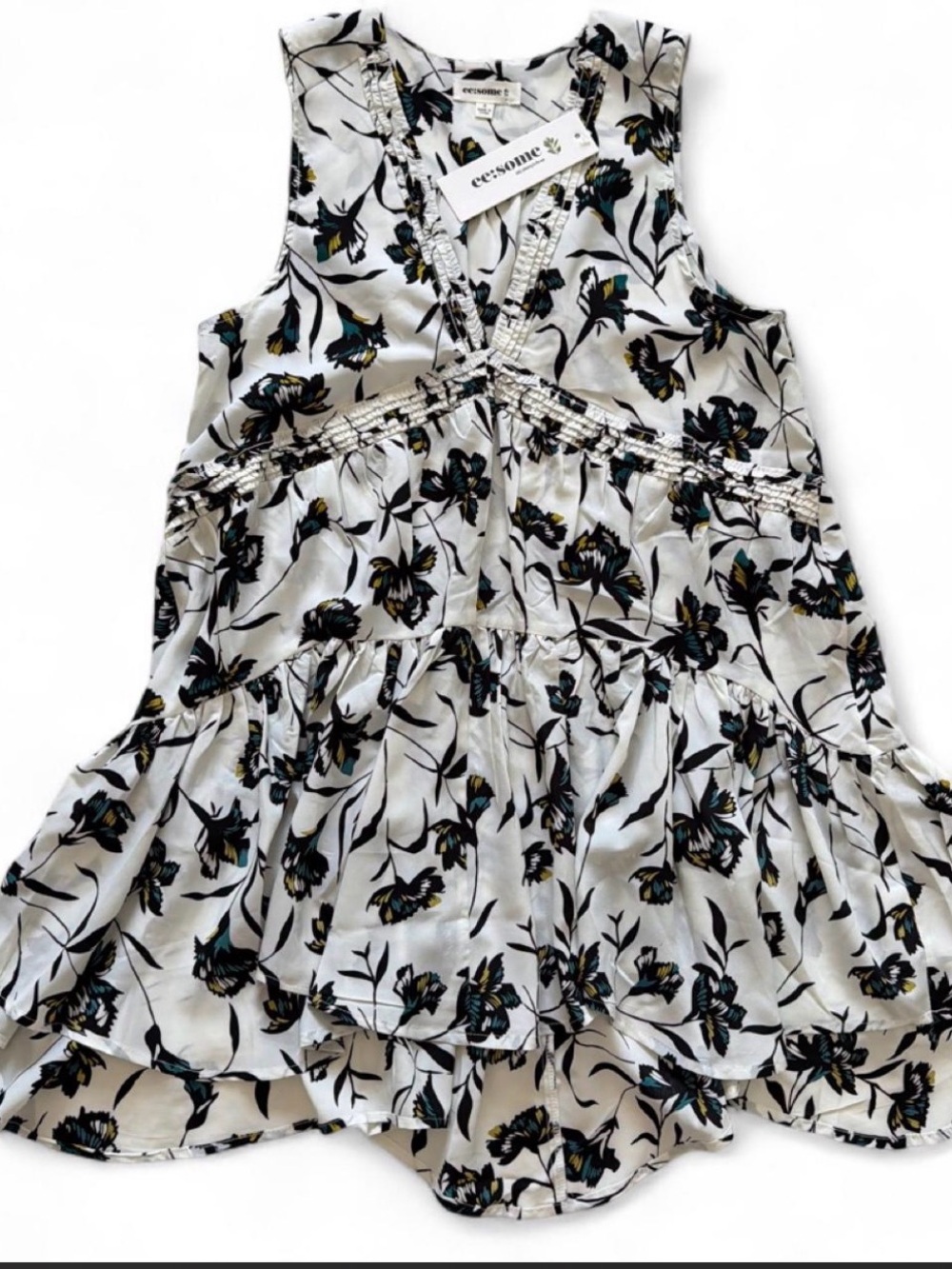 eesome White Floral Sleeveless V-Neck Tunic with Black & Teal Accents